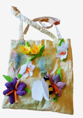 Tote bag with floral decorations on a white background