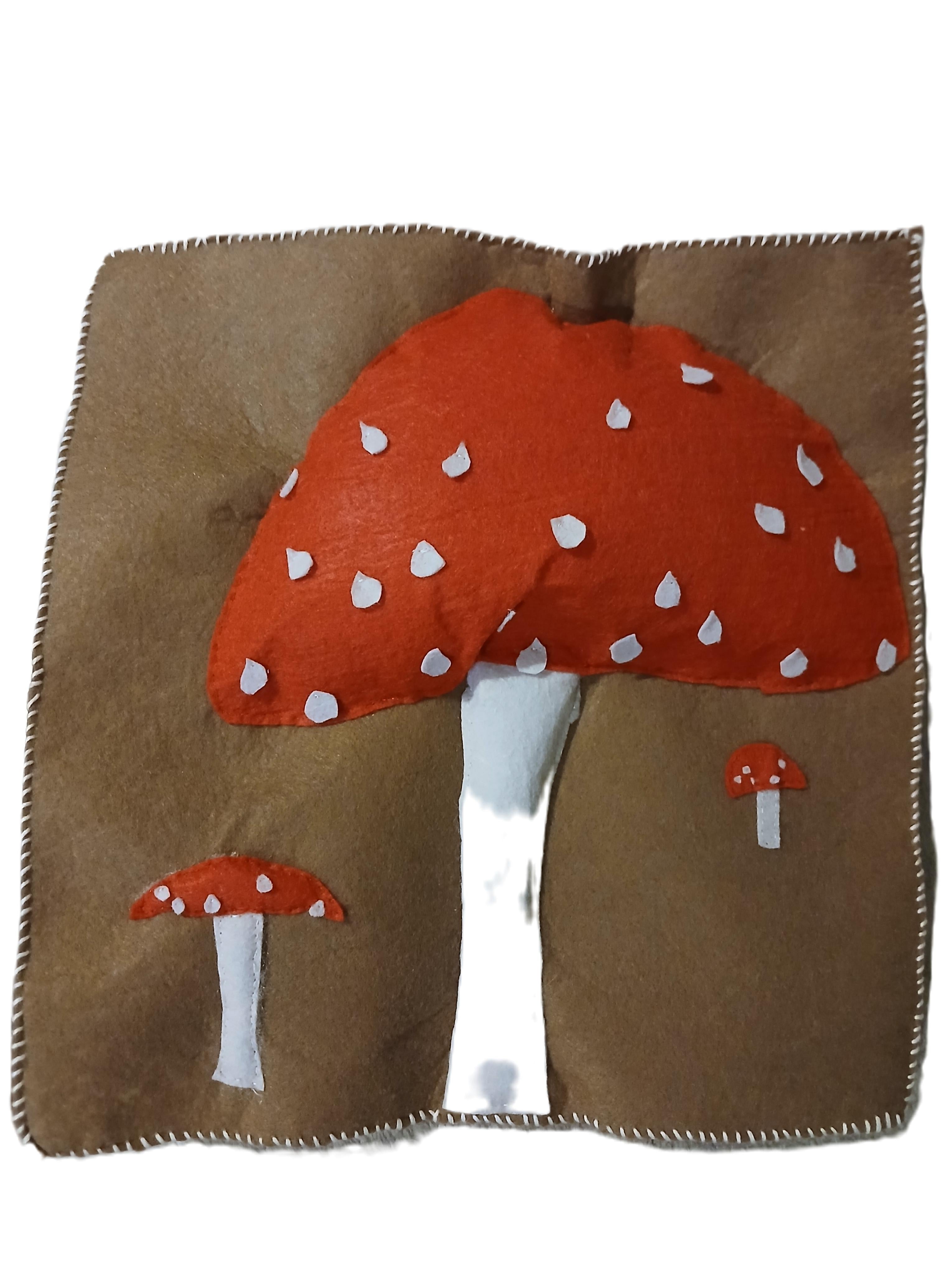 Brown fabric with red mushroom design on a white background